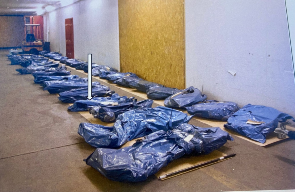picture of the 18 stolen bikes, wrapped in blue plastic, ready to be shipped out of the country