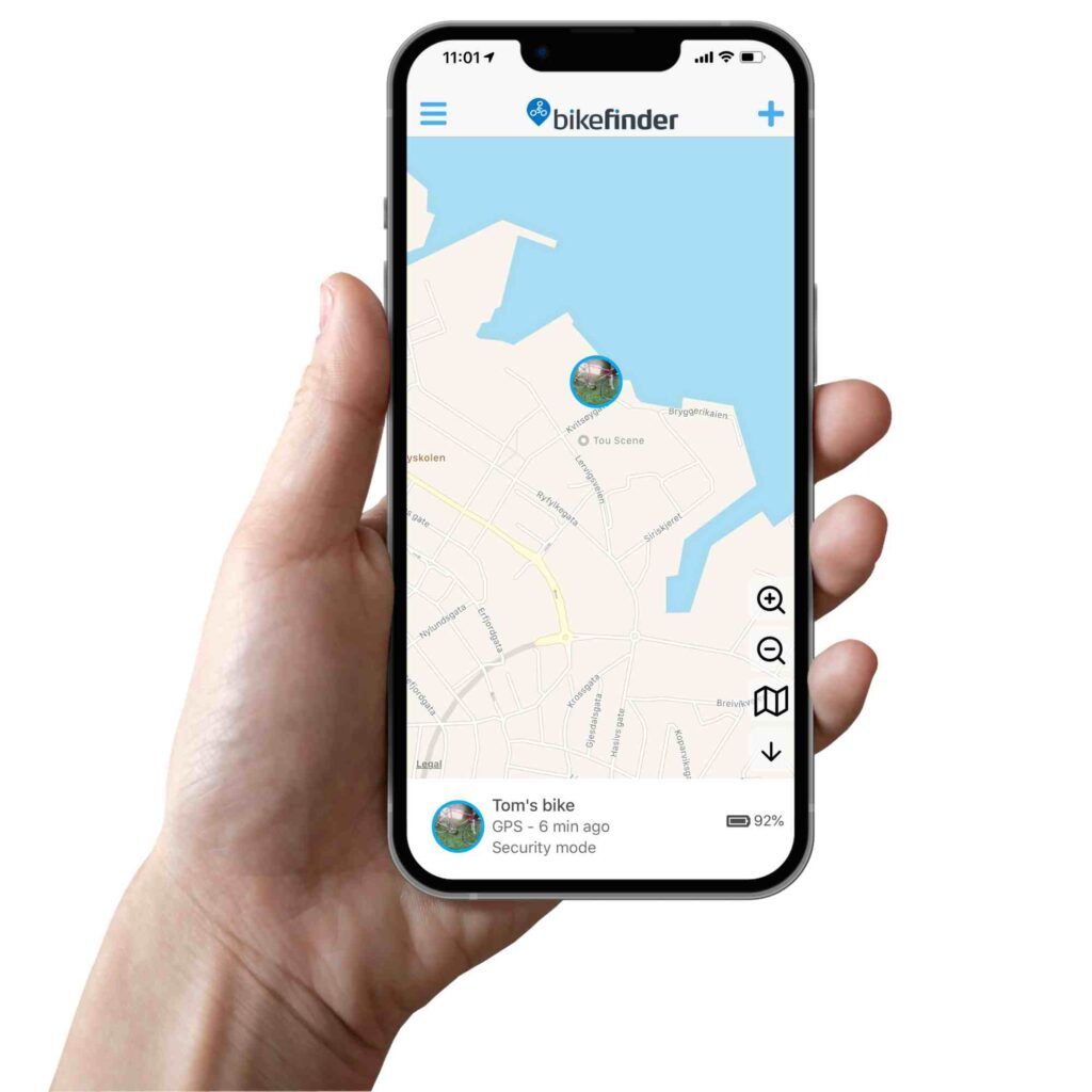 Picture of a hand holding a phone displaying the bikefinder app