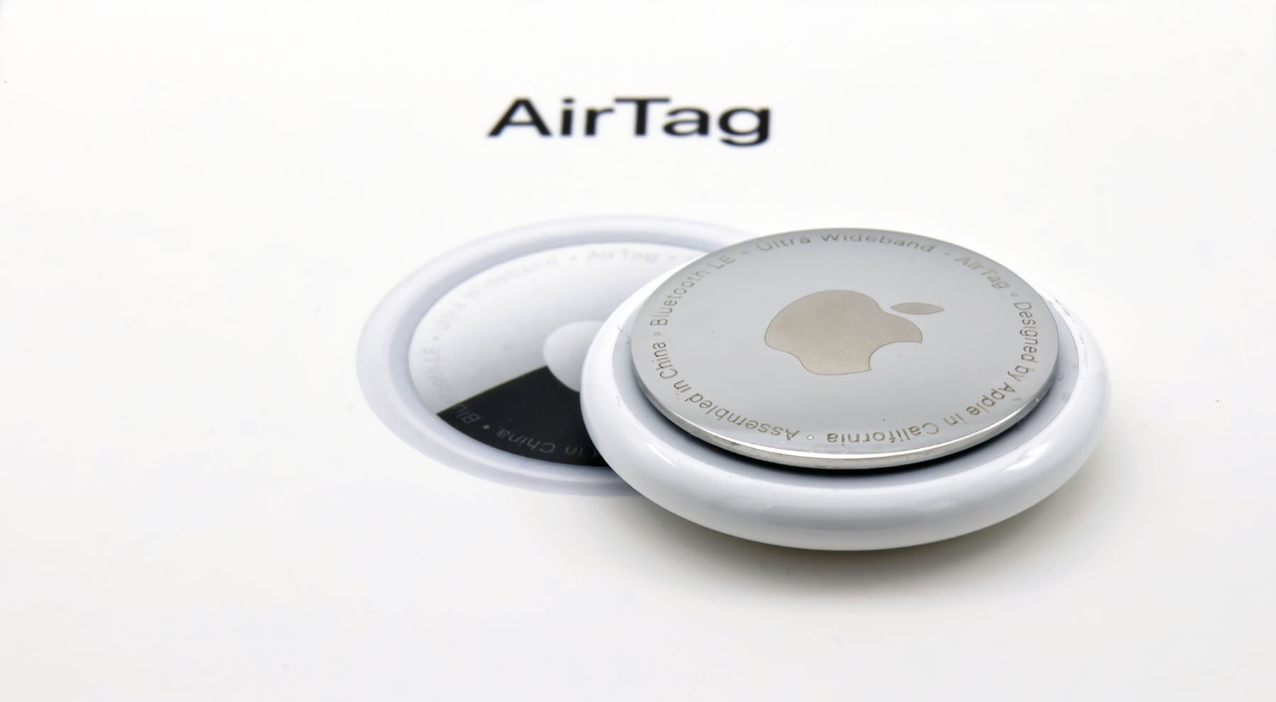 lose-up of an Apple AirTag device used for Bluetooth tracking, illustrating why AirTags are less reliable for bike theft protection compared to GPS bike trackers like BikeFinder.